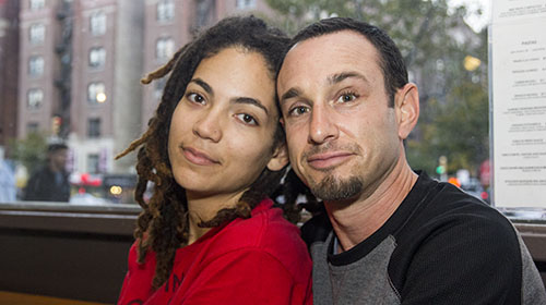 Christina Gonzalez and Matthew Swaye are leaders of the Copwatch movement uptown. Instead of actively searching for stop-and-frisks in their neighborhood they go about their day, but are ever mindful of the opportunity to record an event as it unfolds. (Photo by Kaitlyn Wells)