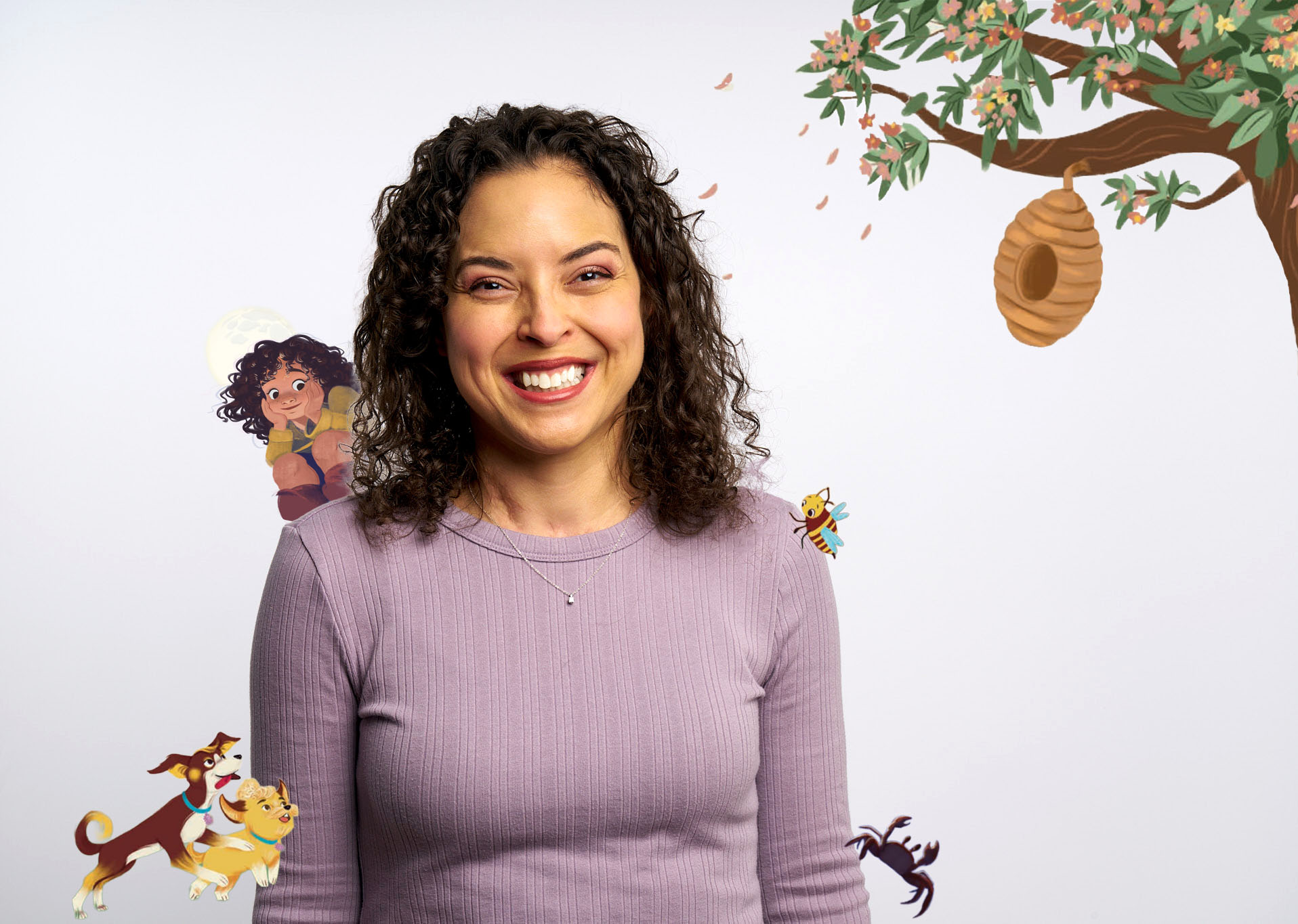 Kaitlyn Wells surrounded by characters from her picture books